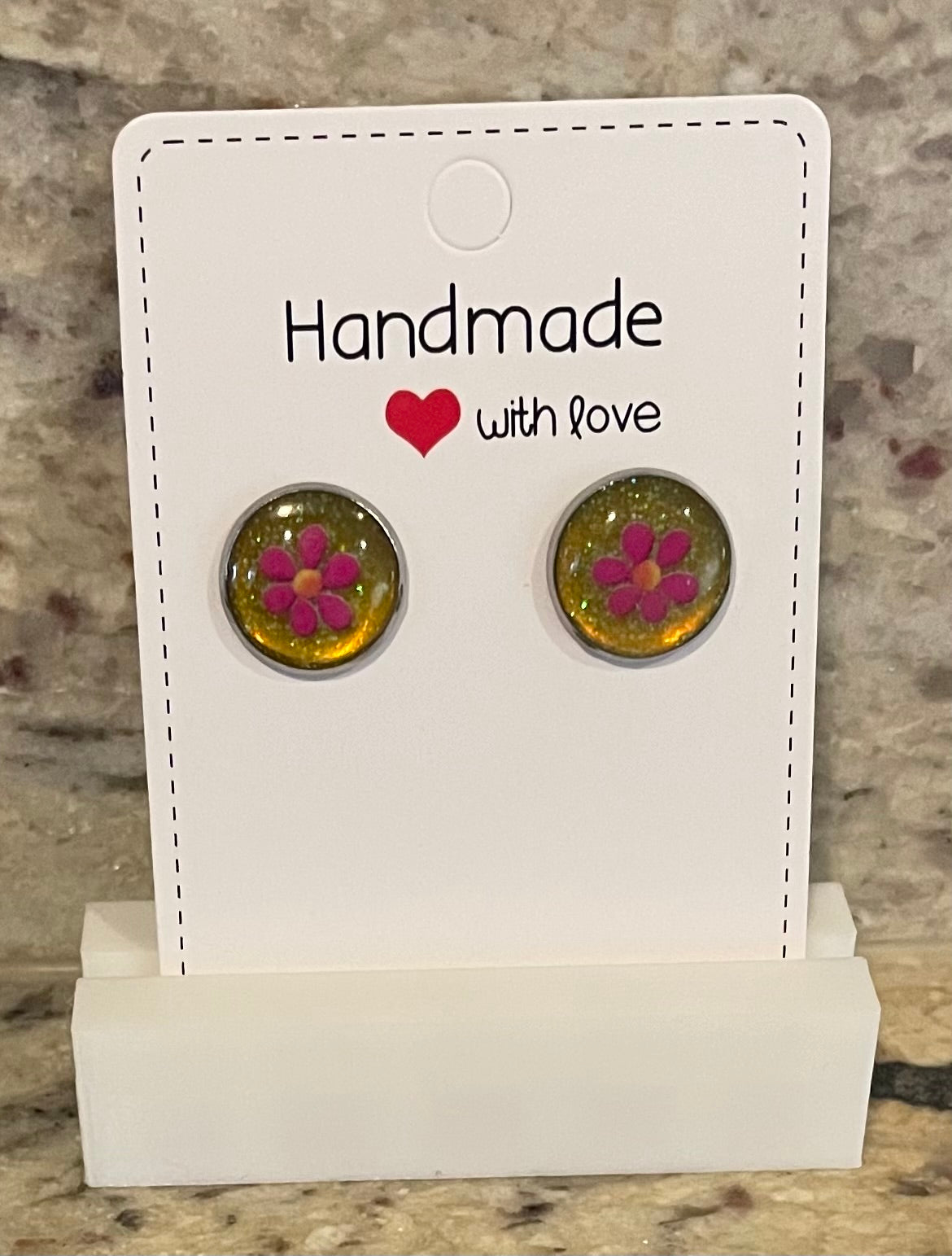 Handmade Glitter Resin Studs with Pink Flower Decal and Glittery Yellow/Gold Background. Perfect gift for a special occasion.
